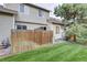 Private backyard with wooden fence and lawn area at 3813 E 121St Ave, Thornton, CO 80241