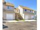 Tan-colored townhome with attached garage and landscaping at 3813 E 121St Ave, Thornton, CO 80241