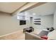 Finished basement with living area and TV at 6403 Zang Ct, Arvada, CO 80004