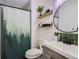 Bathroom with green accents and walk-in shower at 6403 Zang Ct, Arvada, CO 80004