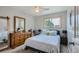 Bedroom with light blue bedding and barn door mirror at 6403 Zang Ct, Arvada, CO 80004