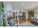 Charming dining area with hardwood floors and a view to the living room at 6403 Zang Ct, Arvada, CO 80004