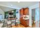 Open kitchen with wooden cabinets and a view to the Gathering room at 6403 Zang Ct, Arvada, CO 80004