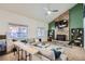 Living room features a stone fireplace and built-in shelving at 6403 Zang Ct, Arvada, CO 80004