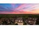 Aerial view of a home in a community with a golf course and mountain views at 7606 S Valleyhead Ct, Aurora, CO 80016
