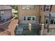 Back deck with stone trim and wooden stairs at 7606 S Valleyhead Ct, Aurora, CO 80016