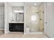 Luxurious primary bath with dual vanity, granite countertops, and a glass-enclosed shower at 7606 S Valleyhead Ct, Aurora, CO 80016