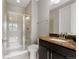 Bathroom with walk-in shower and marble-topped vanity at 7606 S Valleyhead Ct, Aurora, CO 80016