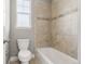 Clean bathroom with tiled shower and bath at 7606 S Valleyhead Ct, Aurora, CO 80016