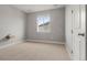 Bedroom with carpet and window at 7606 S Valleyhead Ct, Aurora, CO 80016