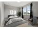 This staged primary bedroom features neutral walls, carpet, and abundant natural light at 7606 S Valleyhead Ct, Aurora, CO 80016
