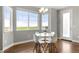 Bright breakfast nook with a round table and view of the surrounding landscape at 7606 S Valleyhead Ct, Aurora, CO 80016