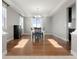 Dining room featuring hardwood floors and a modern chandelier at 7606 S Valleyhead Ct, Aurora, CO 80016