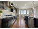 Bright and airy kitchen featuring granite counters and stainless steel appliances at 7606 S Valleyhead Ct, Aurora, CO 80016