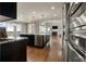 Modern kitchen with stainless steel appliances and granite countertops at 7606 S Valleyhead Ct, Aurora, CO 80016