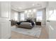 Serene primary bedroom with tray ceilings, a plush king bed, and abundant natural light at 7606 S Valleyhead Ct, Aurora, CO 80016