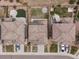 Aerial view of the neighborhood showing well-manicured yards and modern homes with paved driveways at 14710 Domino Dr, Parker, CO 80134