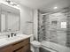 Modern bathroom featuring tiled shower with glass door, contemporary vanity, and updated fixtures at 14710 Domino Dr, Parker, CO 80134