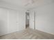Bedroom showcasing neutral carpet, a ceiling fan, and a closet with white sliding doors for ample storage at 14710 Domino Dr, Parker, CO 80134
