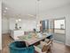 Open-concept dining room with island kitchen and a sliding glass door to the outdoor deck at 14710 Domino Dr, Parker, CO 80134