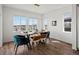 Bright dining room with large windows offering scenic views and a modern table setting at 14710 Domino Dr, Parker, CO 80134