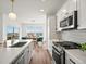 Well-equipped kitchen with stainless steel appliances, ample counter space, and a view to the dining area at 14710 Domino Dr, Parker, CO 80134