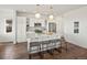 Bright kitchen features a large island with seating, pendant lighting, and stainless steel appliances at 14710 Domino Dr, Parker, CO 80134