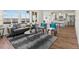 Bright living room with large windows, modern furniture, and an open floor plan at 14710 Domino Dr, Parker, CO 80134