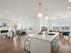 Open-concept kitchen, dining, and living area with lots of natural light and modern finishes at 14710 Domino Dr, Parker, CO 80134