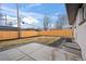 Fenced backyard with a concrete patio, garden beds, and newly installed lawn at 9230 Aspen Dr, Thornton, CO 80229