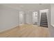 Finished basement featuring new floors, stairs, and convenient closet access at 9230 Aspen Dr, Thornton, CO 80229