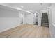 Spacious finished basement with new floors, modern lighting, and access to the upper levels at 9230 Aspen Dr, Thornton, CO 80229