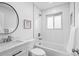 Bright bathroom featuring white subway tile, modern fixtures, and a shower-tub combo for a clean and contemporary look at 9230 Aspen Dr, Thornton, CO 80229