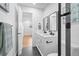 Bright bathroom featuring double vanity, modern fixtures, and tiled floors for a clean and functional space at 9230 Aspen Dr, Thornton, CO 80229