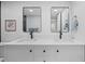 Modern bathroom vanity with double sinks, sleek black fixtures, and stylish decor at 9230 Aspen Dr, Thornton, CO 80229