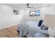 Cozy bedroom featuring a ceiling fan, window, and contemporary decor at 9230 Aspen Dr, Thornton, CO 80229