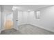 Bedroom featuring plush gray carpet, closet, and access to a bright hallway, for flexible living at 9230 Aspen Dr, Thornton, CO 80229