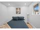 Well-lit bedroom with a window, a neutral color scheme and decor at 9230 Aspen Dr, Thornton, CO 80229