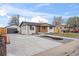 Lovely home showcasing modern updates, including a detached garage, spacious driveway, and newly landscaped front yard at 9230 Aspen Dr, Thornton, CO 80229