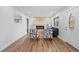 Bright living room featuring hardwood floors, an electric fireplace, and modern decor for a cozy and inviting atmosphere at 9230 Aspen Dr, Thornton, CO 80229