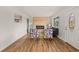 Bright living room featuring hardwood floors, an electric fireplace, and modern decor for a cozy and inviting atmosphere at 9230 Aspen Dr, Thornton, CO 80229