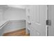 Bright walk-in closet featuring custom shelving and a hanging rod system for optimal organization at 9230 Aspen Dr, Thornton, CO 80229