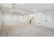 Large finished basement featuring carpeted floors and staircase at 6207 E 155Th Pl, Brighton, CO 80602