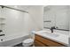 Bright bathroom features a tub with white subway tile surround, modern vanity, and hexagon tile flooring at 6207 E 155Th Pl, Brighton, CO 80602