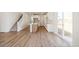 Modern, open kitchen features an island, stainless steel appliances, and white cabinets at 6207 E 155Th Pl, Brighton, CO 80602