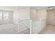 Spacious upstairs landing area with carpet flooring and staircase at 6207 E 155Th Pl, Brighton, CO 80602