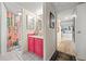 Bright bathroom featuring a pink vanity cabinet and a shower with a colorful floral curtain at 777 N Washington St # 304, Denver, CO 80203