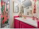 Stylish bathroom with a pink vanity and a floral shower curtain adding charm and personality at 777 N Washington St # 304, Denver, CO 80203