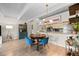 Cozy dining area with an octagonal table, stylish chairs, and views of kitchen area at 777 N Washington St # 304, Denver, CO 80203