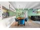 Comfortable dining area featuring an octagonal table, stylish chairs, and views of living room at 777 N Washington St # 304, Denver, CO 80203